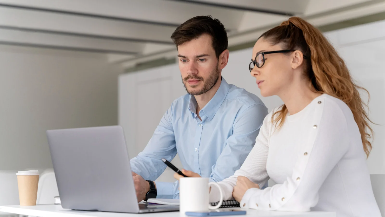 business team working on notebook with dropbox alternative luckycloud